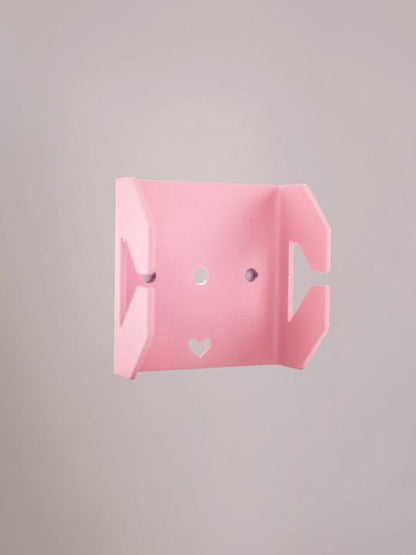 Roze bracket van Studio Mippe voor het ophangen van wandplank trays in elke kleurcombinatie.