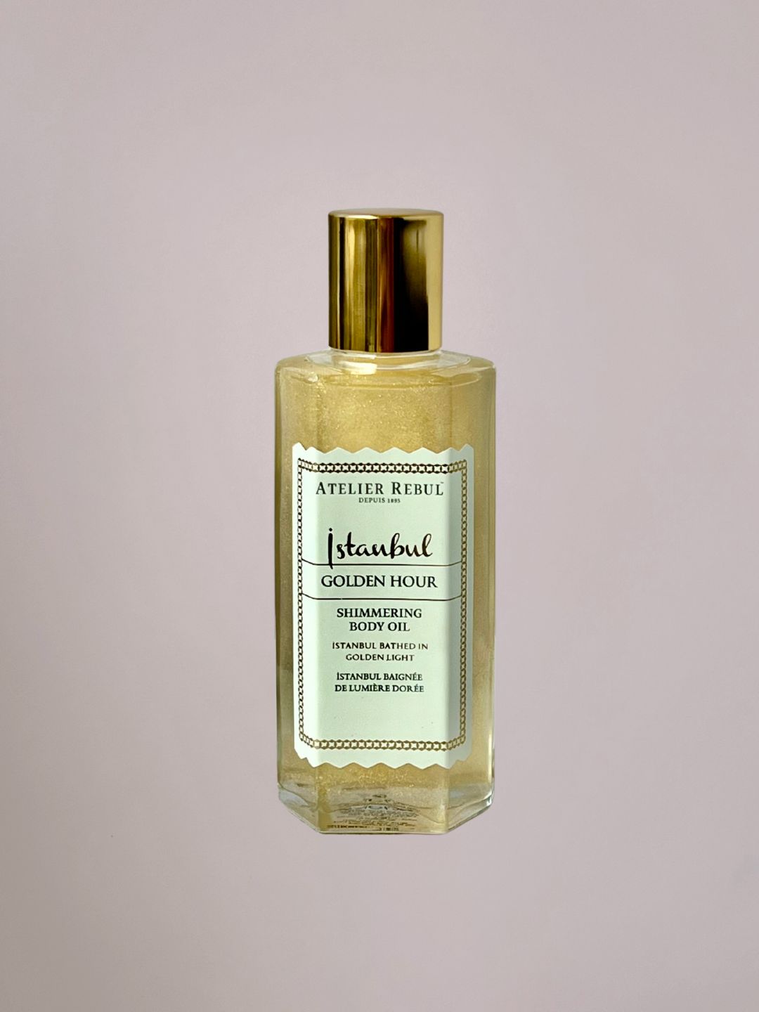 Golden Hour Body Shimmer van Atelier Rebul met subtiele gouden glans en warme luxe geur.