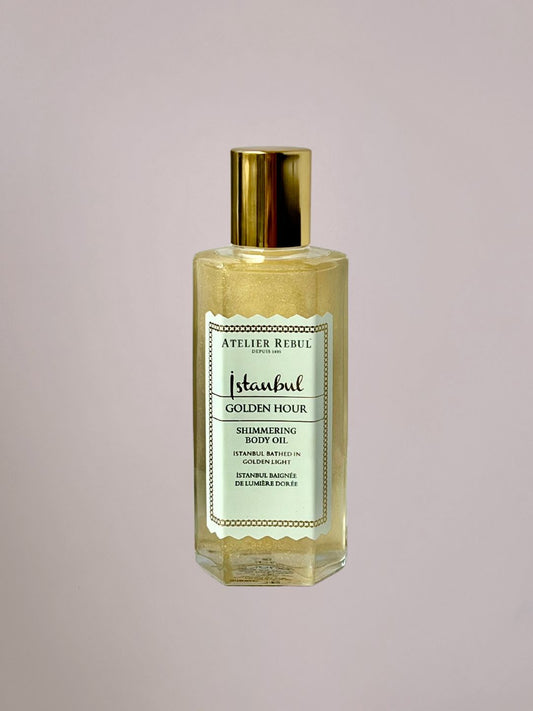 Golden Hour Body Shimmer van Atelier Rebul met subtiele gouden glans en warme luxe geur.