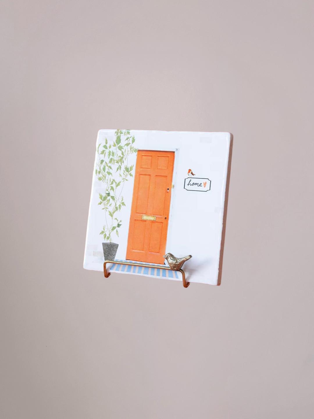 Golden Stand Bird messing tegelhouder met StoryTiles tegel erin bij Anja Bloementrends