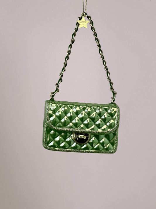 Close-up van lichtgroene handtas kerstbal met kusseneffect, glitters en goudkleurige metalen ringen, bijzondere kerstbal en Vondels kerstornament